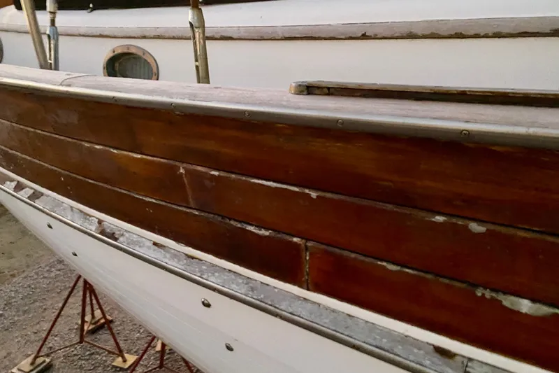 Slide: The Image of Wooden hull of 1991 Hans Christian 41 T Molakai sailboat on stands. - 125
