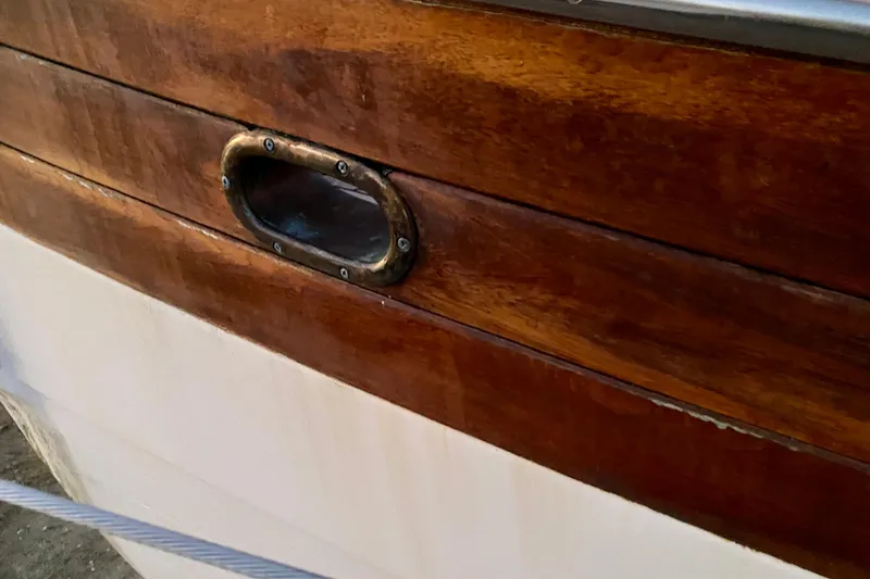 Slide: The Image of Close-up of 1991 Hans Christian 41 T Molakai's polished wooden hull detail. - 127