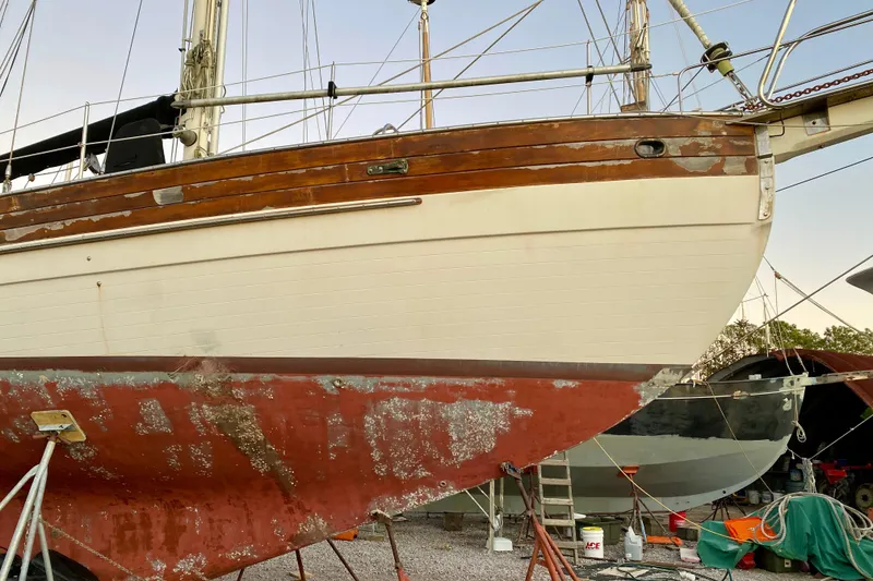Slide: The Image of 1991 Hans Christian 41 T Molakai sailboat undergoing maintenance on dry dock. - 16