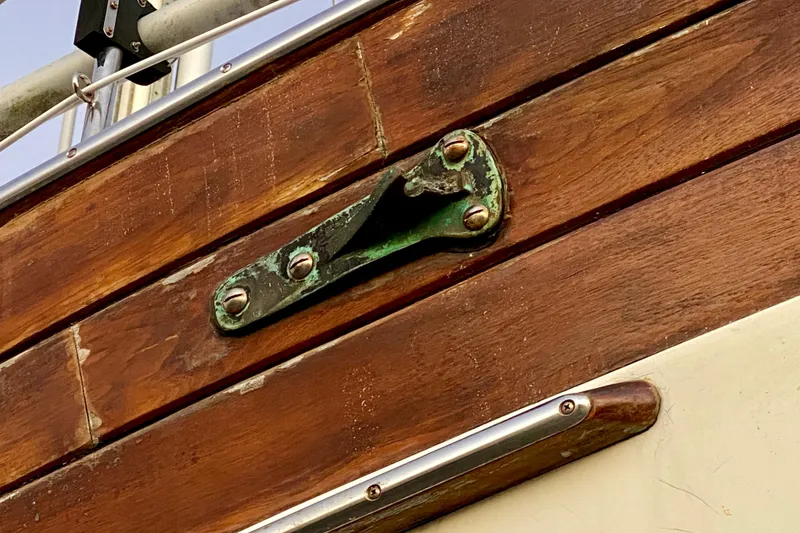 Slide: The Image of Wooden detail of 1991 Hans Christian 41 T Molakai sailboat with metal fitting. - 17