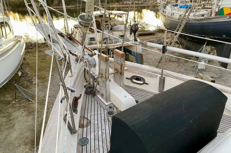Slide: The Image of 1991 Hans Christian 41 T Molakai sailboat on land, showcasing deck and rigging details. - 29