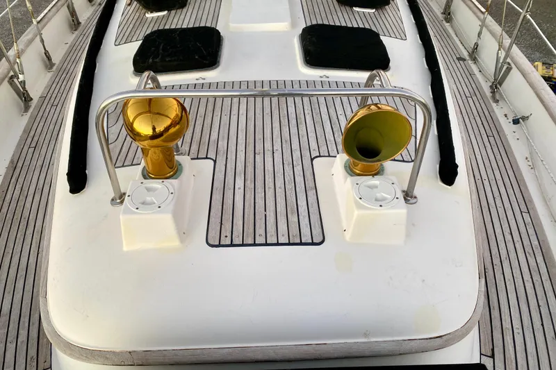 Slide: The Image of Deck of 1991 Hans Christian 41 T Molakai sailboat with brass vents and wooden flooring. - 31
