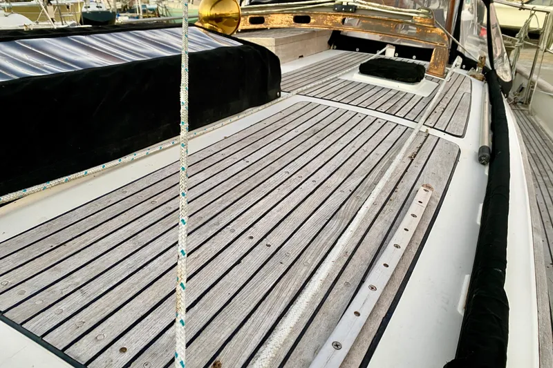 Slide: The Image of Deck of 1991 Hans Christian 41 T Molakai sailboat with wooden planks and rigging. - 37