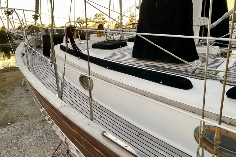 Slide: The Image of Sailboat deck of 1991 Hans Christian 41 T Molakai, featuring wooden and metal details. - 39