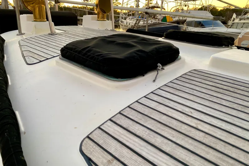 Slide: The Image of Deck of 1991 Hans Christian 41 T Molakai sailboat with wooden panels and hatches. - 41