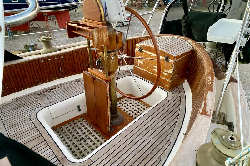 Slide: The Image of Cockpit of 1991 Hans Christian 41 T Molakai sailboat with wooden steering wheel and seating. - 47