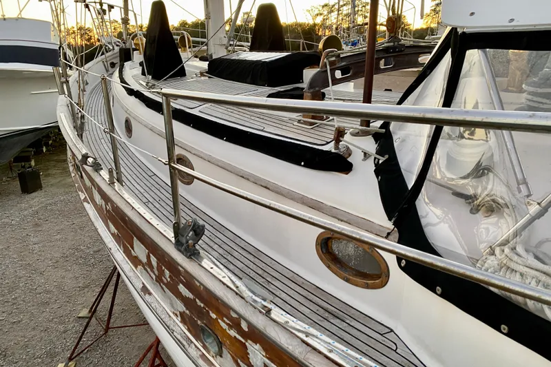 Slide: The Image of 1991 Hans Christian 41 T Molakai sailboat with wooden deck and railings in a boatyard. - 48