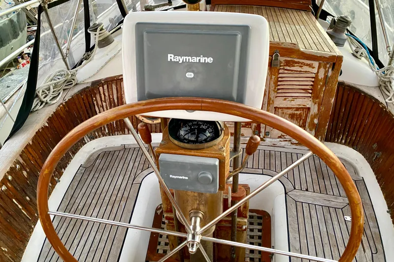 Slide: The Image of Steering wheel and navigation equipment on 1991 Hans Christian 41 T Molakai sailboat. - 59