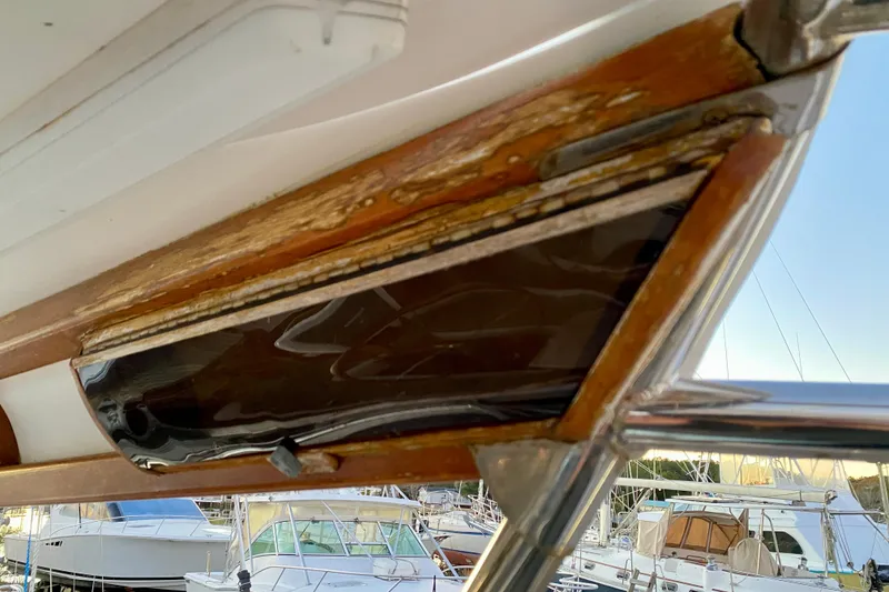 Slide: The Image of Close-up of 1991 Hans Christian 41 T Molakai yacht's weathered wooden frame detail. - 61