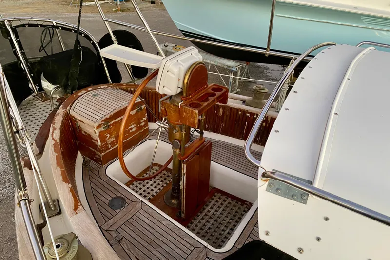 Slide: The Image of Cockpit of 1991 Hans Christian 41 T Molakai sailboat with wooden and metal details. - 74