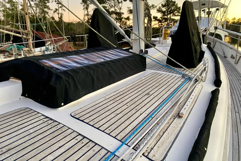 Slide: The Image of 1991 Hans Christian 41 T Molakai sailboat deck with wooden slats and rigging. - 81