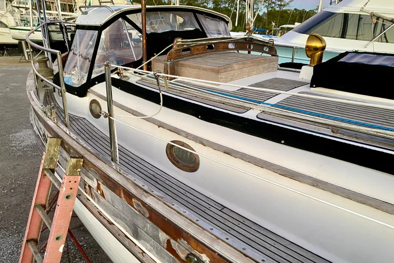 Slide: The Image of Sailboat Hans Christian 41 T Molakai 1991 on dry dock with visible deck and ladder. - 84