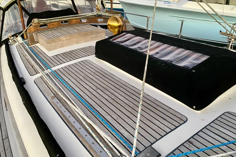 Slide: The Image of Deck of 1991 Hans Christian 41 T Molakai sailboat with wooden accents and ropes. - 87