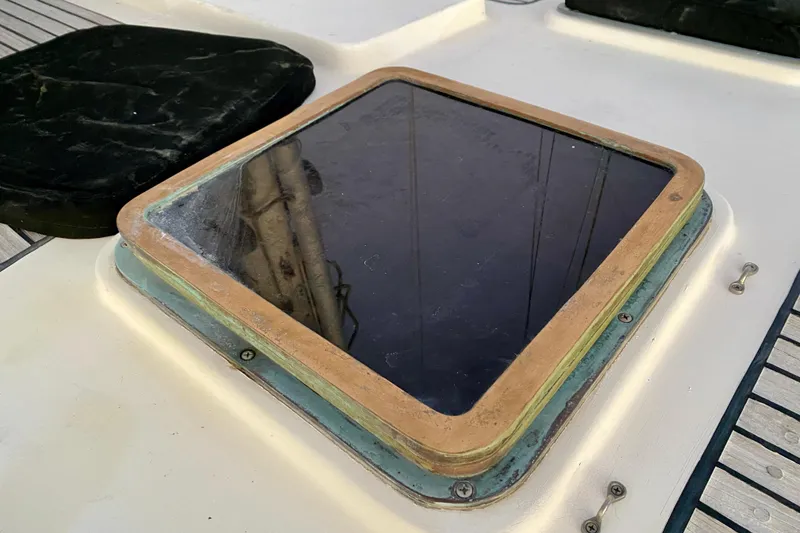 Slide: The Image of Deck hatch of 1991 Hans Christian 41 T Molakai sailboat, featuring a wooden frame. - 88