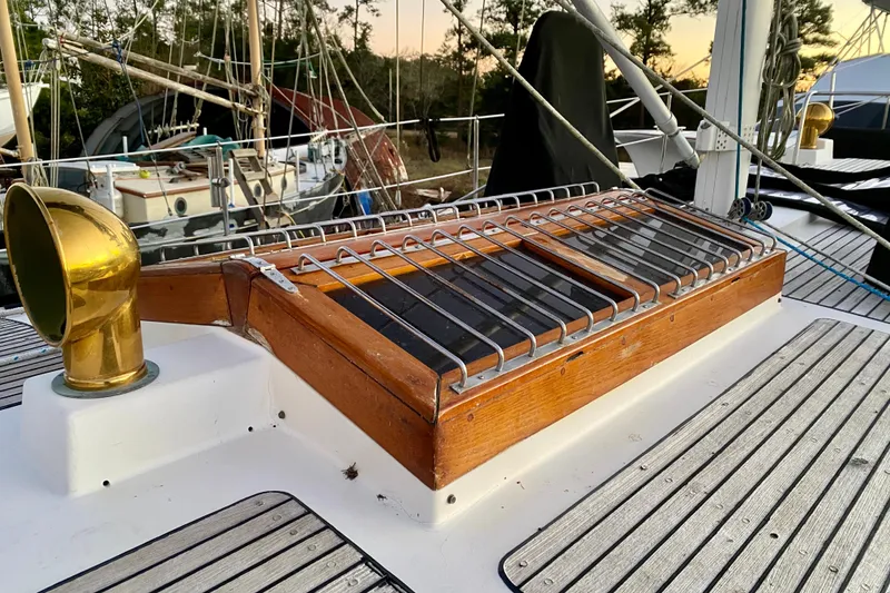 Slide: The Image of Deck of 1991 Hans Christian 41 T Molakai sailboat with wooden hatch and brass vent. - 91