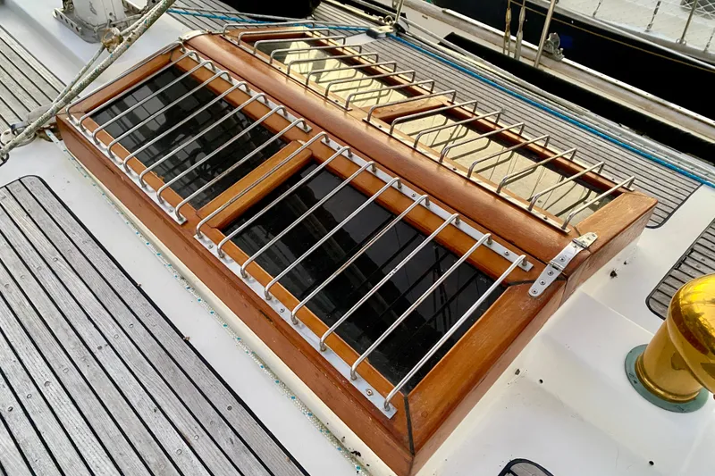 Slide: The Image of Deck of 1991 Hans Christian 41 T Molakai sailboat with wooden and metal hatch. - 92