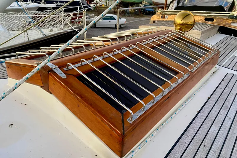 Slide: The Image of Deck detail of 1991 Hans Christian 41 T Molakai sailboat with wooden and metal accents. - 93