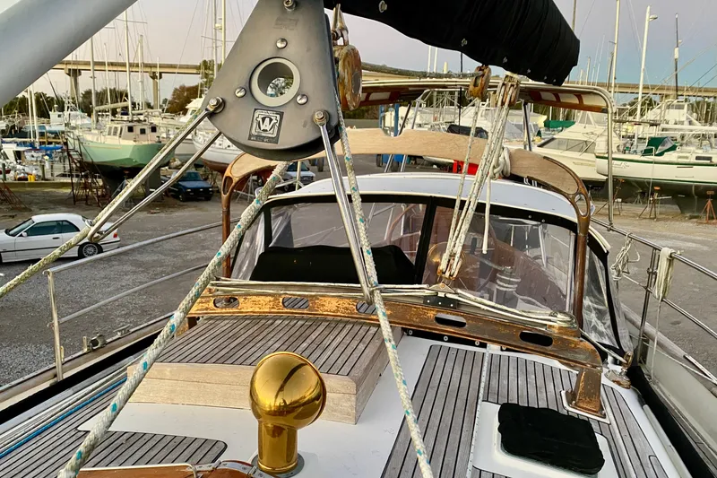 Slide: The Image of Sailboat deck of 1991 Hans Christian 41 T Molakai in a marina setting. - 94