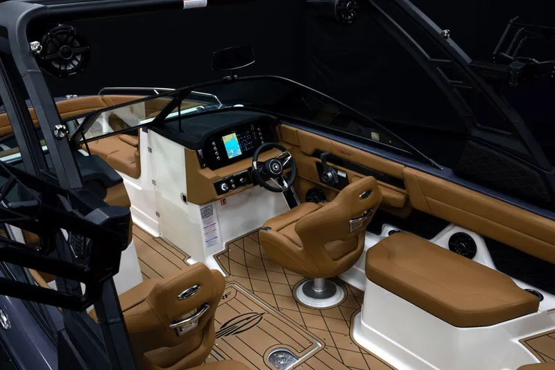 Slide: The Image of Manufacturer Provided Image: 2026 Chaparral GTS 6 boat interior with luxurious brown seating and modern dashboard. - 5