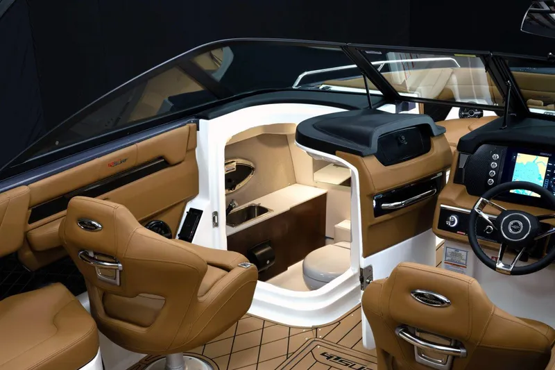 Slide: The Image of Manufacturer Provided Image: 2026 Chaparral GTS 6 boat interior with luxurious seating and modern dashboard. - 6