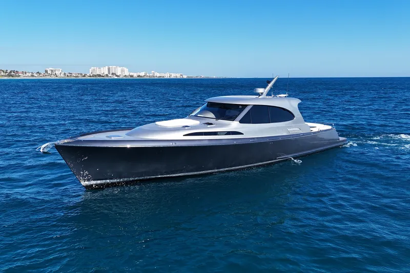 Slide: The Image of 2021 Palm Beach Motor Yachts GT60 cruising on open blue ocean waters. - 28