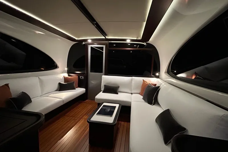 Slide: The Image of Luxurious interior of 2021 Palm Beach Motor Yachts GT60 with elegant seating and ambient lighting. - 3