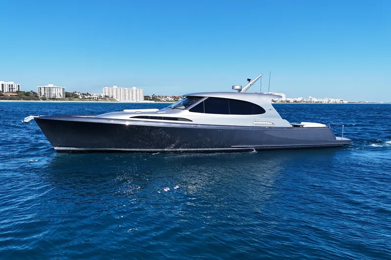 The Image of 2021 Palm Beach Motor Yachts GT60 cruising on blue ocean waters. - 0