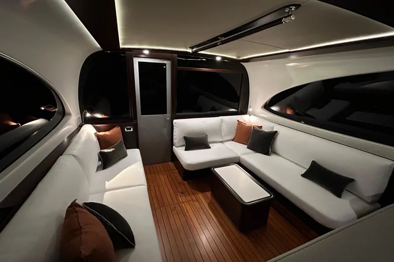 Slide: The Image of Luxurious interior of 2021 Palm Beach Motor Yachts GT60 with elegant seating and ambient lighting. - 11