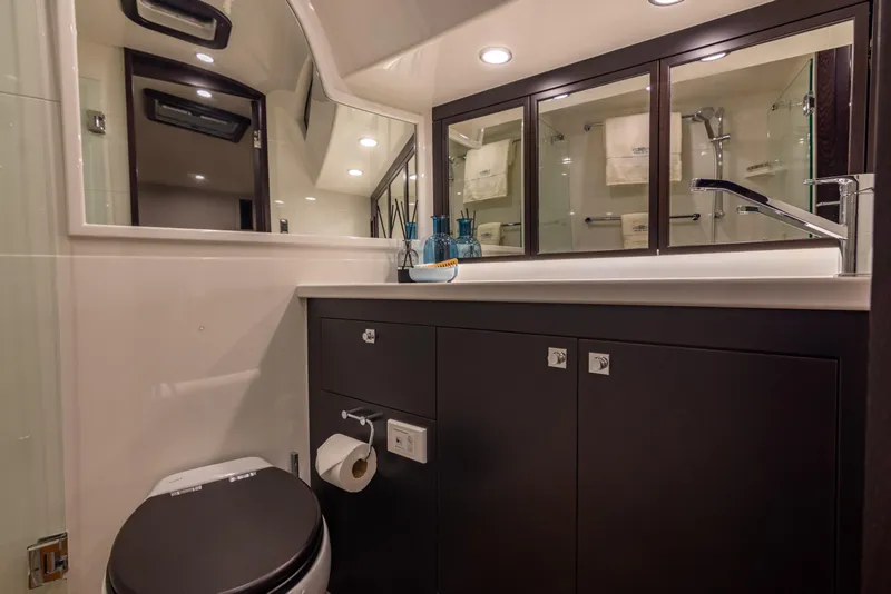 Slide: The Image of Luxurious bathroom in 2021 Palm Beach Motor Yachts GT60, featuring modern fixtures and elegant design. - 25