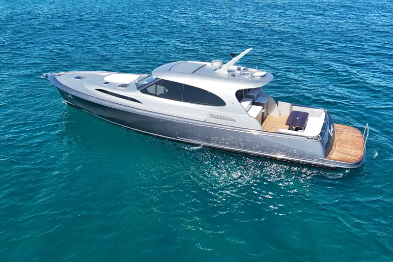 Slide: The Image of 2021 Palm Beach Motor Yachts GT60 cruising on clear blue ocean waters. - 27