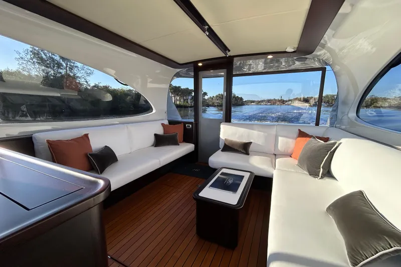 Slide: The Image of Luxurious interior of 2021 Palm Beach Motor Yachts GT60 with elegant seating and scenic views. - 8
