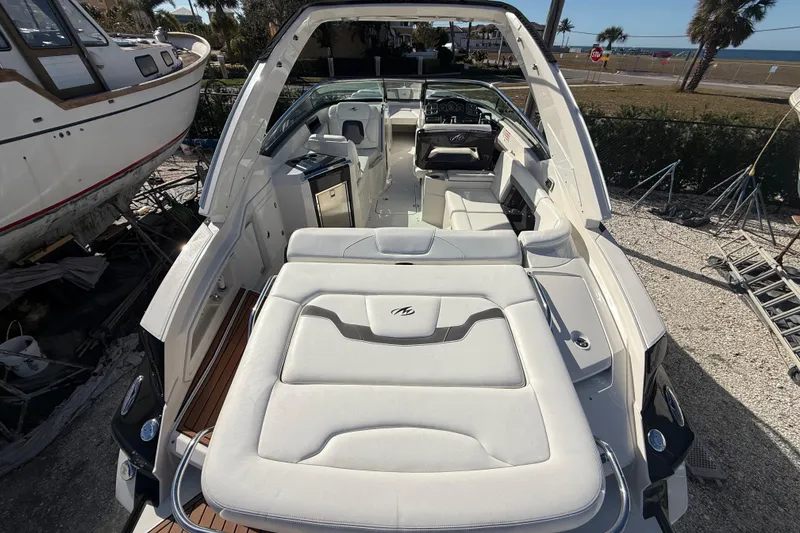 Slide: The Image of 2014 Monterey 328SS Super Sport boat with spacious seating and sleek design. - 11