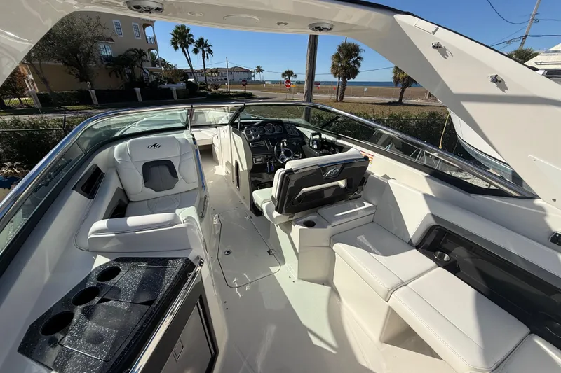 Slide: The Image of 2014 Monterey 328SS Super Sport boat interior with luxurious seating and modern dashboard. - 19