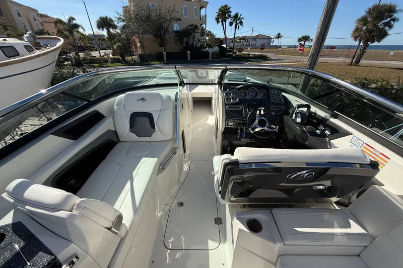 Slide: The Image of 2014 Monterey 328SS Super Sport boat interior with white seating and control panel. - 20