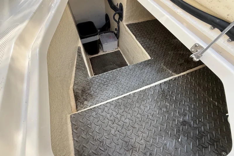 Slide: The Image of Interior steps of a 2014 Monterey 328SS Super Sport boat with diamond plate flooring. - 25