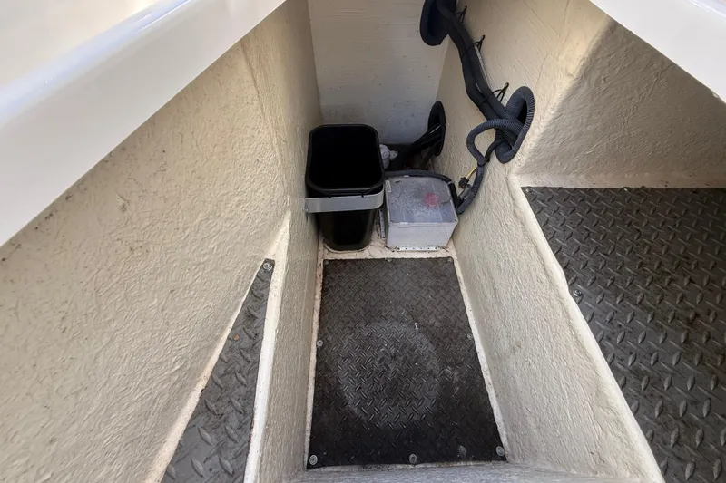 Slide: The Image of Interior of a 2014 Monterey 328SS Super Sport boat showing storage area and wiring. - 26