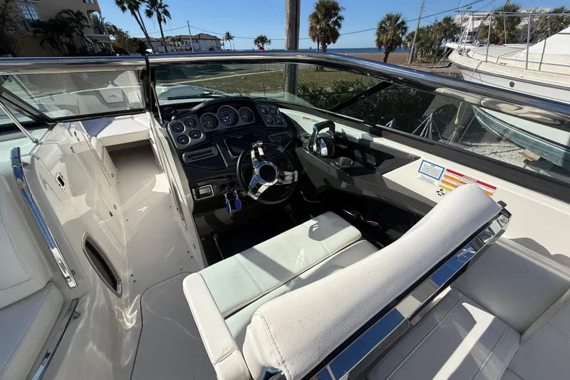 Slide: The Image of 2014 Monterey 328SS Super Sport boat interior with steering wheel and dashboard. - 27