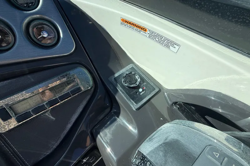 Slide: The Image of Dashboard controls of a 2014 Monterey 328SS Super Sport boat with warning label. - 31
