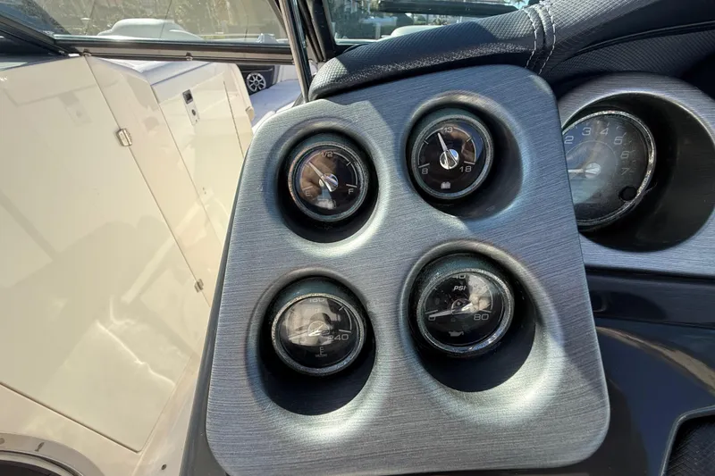 Slide: The Image of Dashboard gauges of a 2014 Monterey 328SS Super Sport boat. - 34