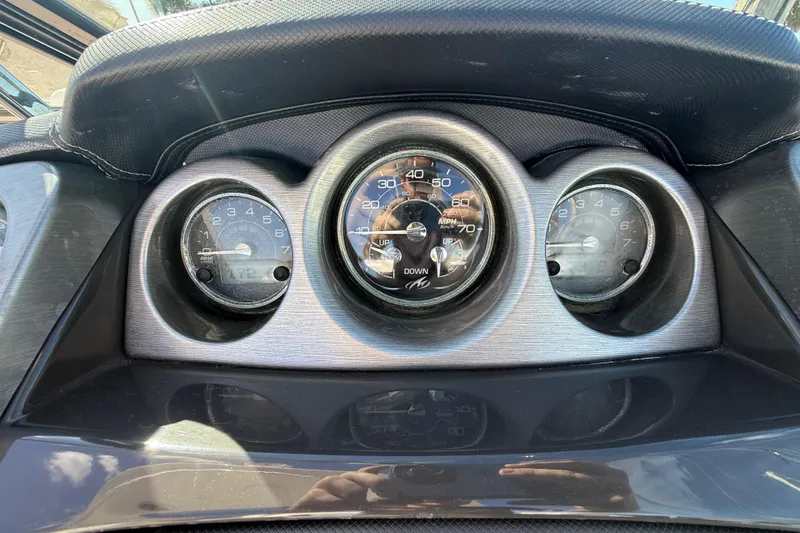 Slide: The Image of Dashboard of a 2014 Monterey 328SS Super Sport boat with speedometer and gauges. - 36