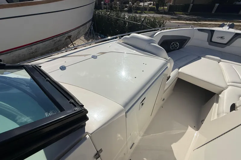 Slide: The Image of 2014 Monterey 328SS Super Sport boat with sleek white interior and seating. - 42