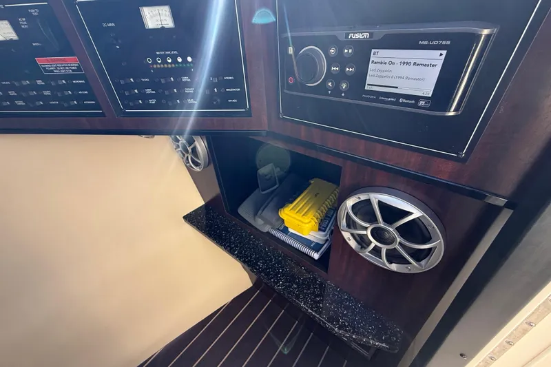 Slide: The Image of Control panel and audio system in 2014 Monterey 328SS Super Sport boat interior. - 44
