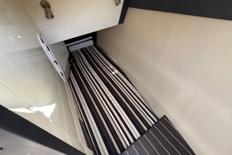 Slide: The Image of 2014 Monterey 328SS Super Sport cabin interior with striped flooring and sleek design. - 47