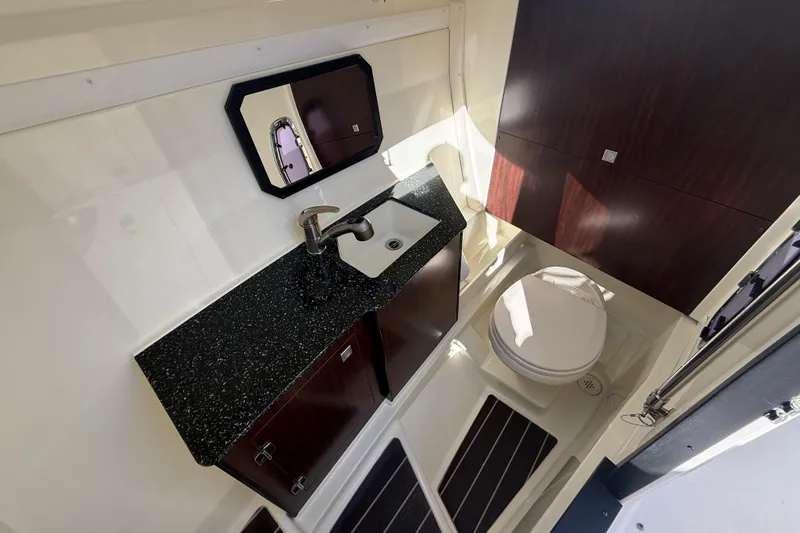 Slide: The Image of Luxurious bathroom interior of 2014 Monterey 328SS Super Sport boat with sink and toilet. - 51