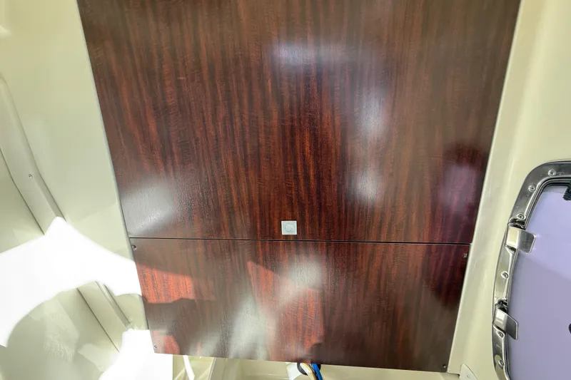 Slide: The Image of Wooden interior panel of a 2014 Monterey 328SS Super Sport boat. - 54