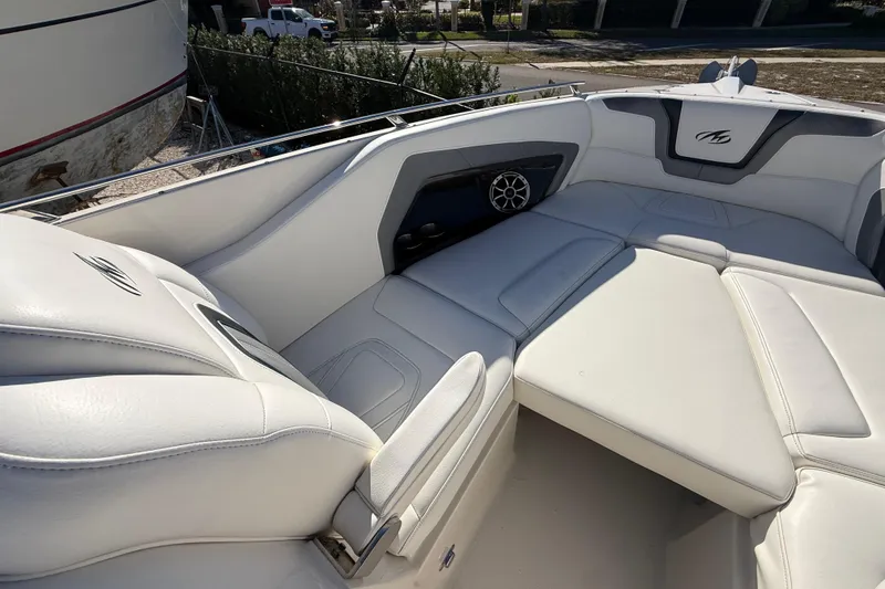 Slide: The Image of 2014 Monterey 328SS Super Sport boat interior with white leather seating. - 58