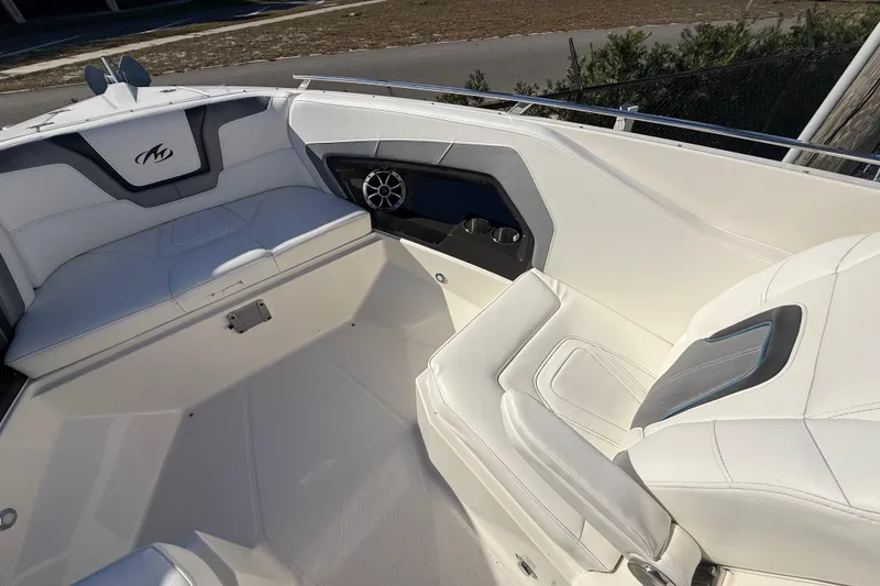 Slide: The Image of 2014 Monterey 328SS Super Sport boat interior with white seating and speaker system. - 69
