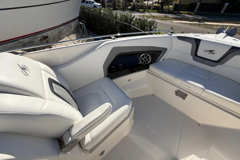 Slide: The Image of 2014 Monterey 328SS Super Sport boat interior with white seating and speaker system. - 70