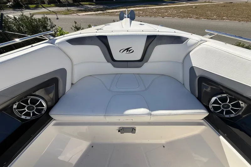 Slide: The Image of 2014 Monterey 328SS Super Sport boat interior with white seating and speakers. - 71