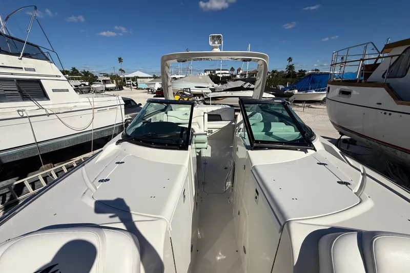 Slide: The Image of 2014 Monterey 328SS Super Sport boat docked under clear blue sky. - 73